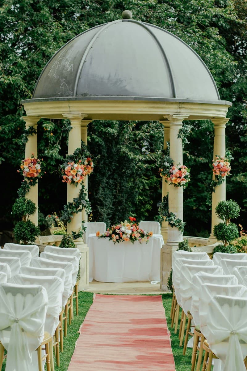 A garden ceremony gazebo decorated with flowers